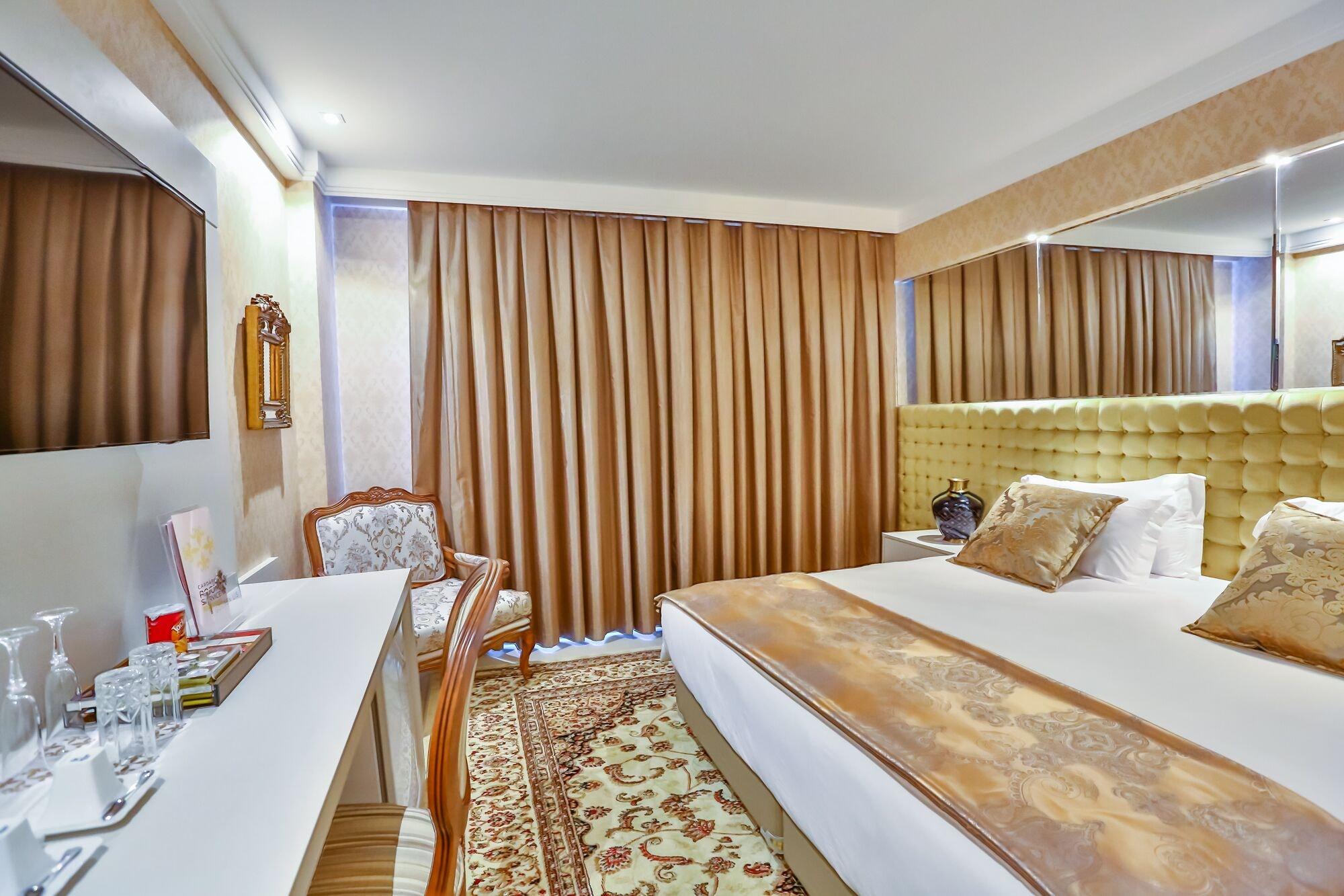 Golden Lis Hotel Boutique 戈亚尼亚 外观 照片 A room at the hotel